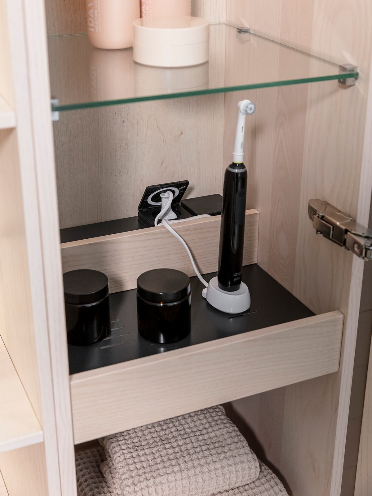 Tall cabinet with a charging station made of heat-resistant stainless steel